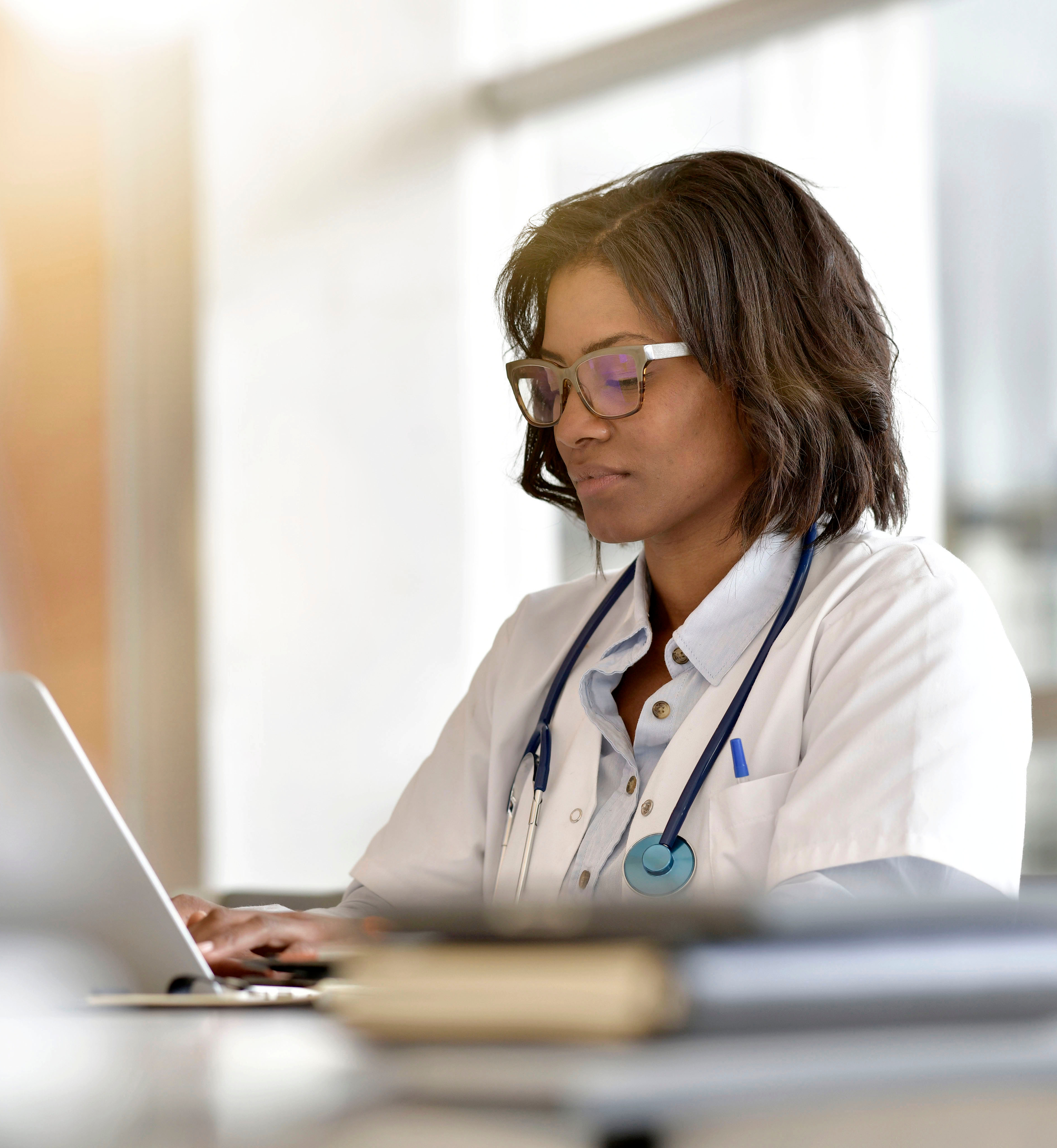 Woman doctor working in office